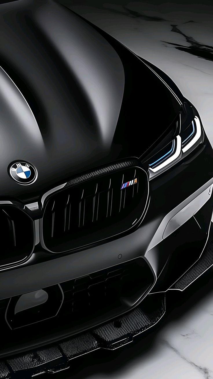 Technician applying PPF film to a luxury car